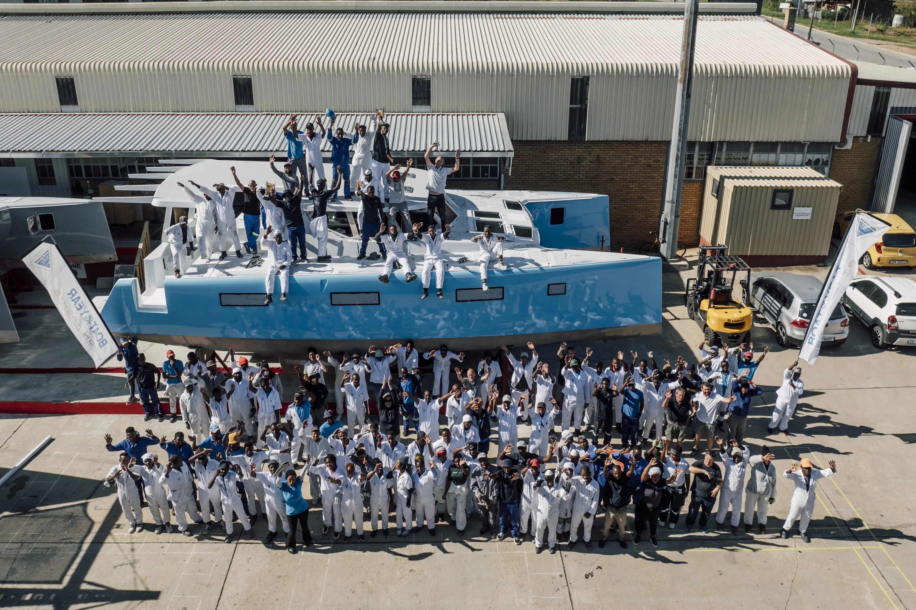 The Knysna yard turned out for a launch, the whole crew around a new hull