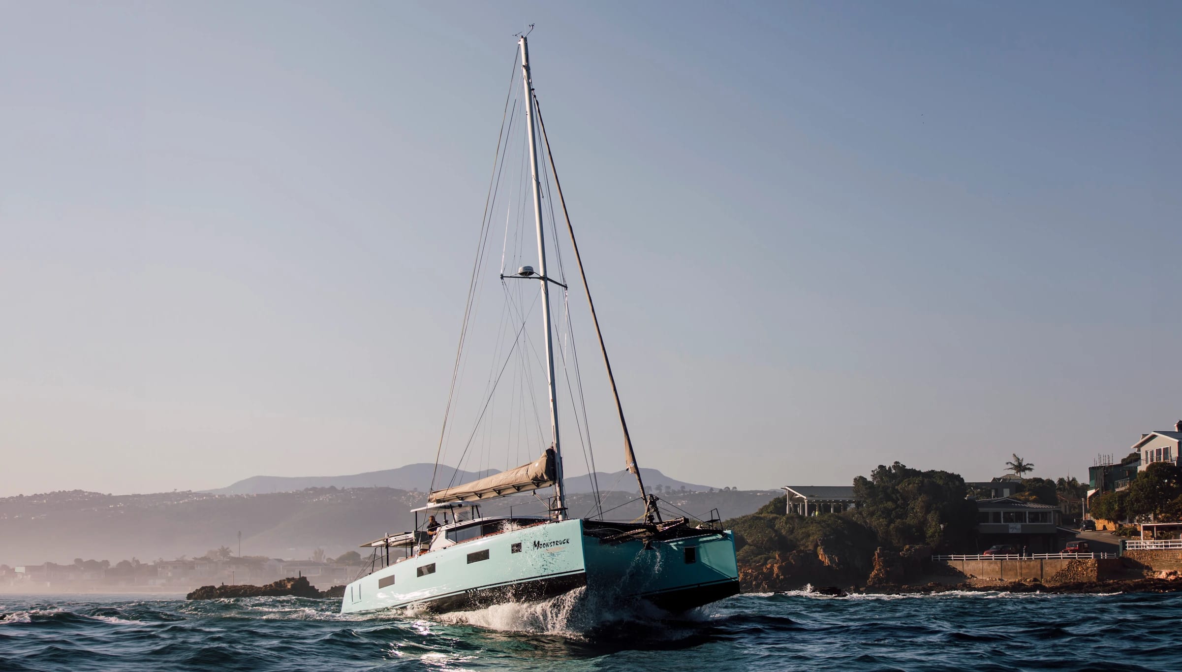 Moonstruck, a Vision catamaran, hard on the wind seen from the air
